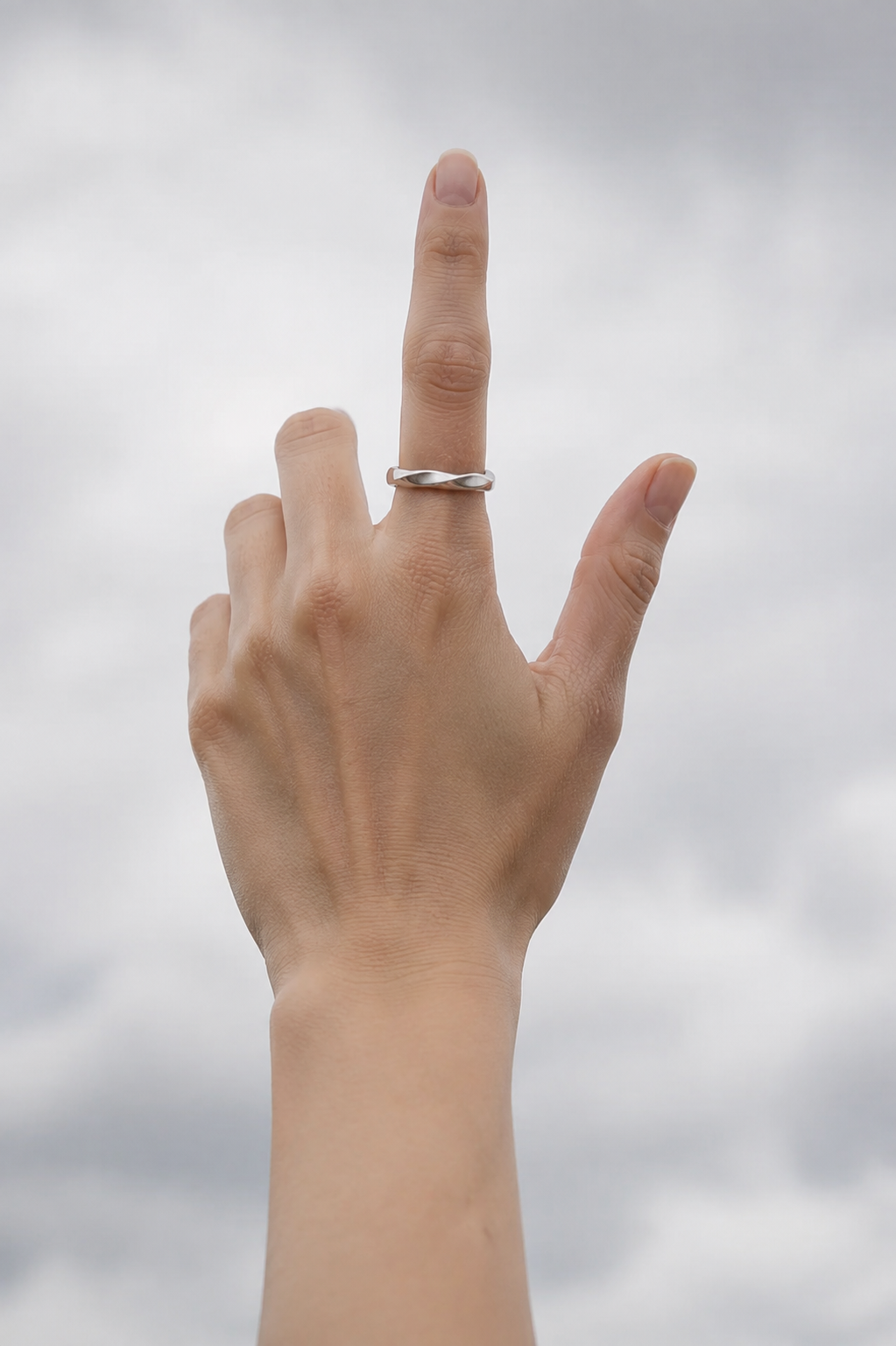 VEER Silver ring worn outdoors on a feminine hand